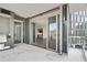 Balcony equipped with an outdoor grill, offering both city vistas and folding glass doors for indoor/outdoor living at 3107 Peachtree Ne Rd # 1005, Atlanta, GA 30305