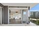 Balcony with views of the city seen through the folding glass doors at 3107 Peachtree Ne Rd # 1005, Atlanta, GA 30305