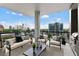 Inviting balcony features a seating area and an outdoor grill with stunning city views at 3107 Peachtree Ne Rd # 1005, Atlanta, GA 30305