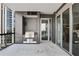 Balcony with outdoor kitchen, stainless steel grill, city view, and access to the interior at 3107 Peachtree Ne Rd # 1005, Atlanta, GA 30305