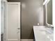 Bathroom with sleek countertop, minimalist mirror, and modern fixtures and a grey color scheme at 3107 Peachtree Ne Rd # 1005, Atlanta, GA 30305