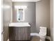 Modern half bathroom featuring a stylish vanity, mirror with LED lighting, and toilet at 3107 Peachtree Ne Rd # 1005, Atlanta, GA 30305