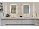 Contemporary bathroom features double vanity sinks, sleek cabinets, and ample counter space at 3107 Peachtree Ne Rd # 1005, Atlanta, GA 30305