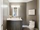 Powder room featuring modern vanity, decorative mirror and fixtures, and hardwood floors at 3107 Peachtree Ne Rd # 1005, Atlanta, GA 30305