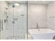 Bathroom showcasing a glass-enclosed shower and modern soaking tub at 3107 Peachtree Ne Rd # 1005, Atlanta, GA 30305