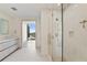 Modern bathroom with glass shower and city view at 3107 Peachtree Ne Rd # 1005, Atlanta, GA 30305