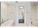 Bright bathroom featuring a glass shower, a soaking tub, and large walk-in closet at 3107 Peachtree Ne Rd # 1005, Atlanta, GA 30305