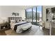 Relaxing bedroom with cityscape views, decorative art, and elegant contemporary decor at 3107 Peachtree Ne Rd # 1005, Atlanta, GA 30305