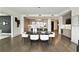 Open-concept dining room with modern table set, adjacent to a well-appointed kitchen with an island and bar at 3107 Peachtree Ne Rd # 1005, Atlanta, GA 30305
