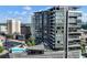 Stunning high-rise featuring modern architecture, balconies, city views, and a rooftop pool at 3107 Peachtree Ne Rd # 1005, Atlanta, GA 30305
