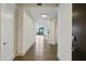 Inviting hallway showcasing hardwood floors and neutral color palette leading to open living area at 3107 Peachtree Ne Rd # 1005, Atlanta, GA 30305