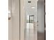 Hallway leading to a bright living area, showcasing modern design and an open floor plan at 3107 Peachtree Ne Rd # 1005, Atlanta, GA 30305
