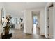 Bright hallway with herringbone floors leading to the kitchen and dining area at 3107 Peachtree Ne Rd # 1005, Atlanta, GA 30305
