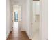 Bright hallway with hardwood floors leading to a laundry room and a cityscape view at 3107 Peachtree Ne Rd # 1005, Atlanta, GA 30305