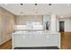 Gourmet kitchen featuring modern appliances, waterfall island, and custom cabinetry at 3107 Peachtree Ne Rd # 1005, Atlanta, GA 30305
