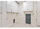 Well-lit laundry room with storage cabinets at 3107 Peachtree Ne Rd # 1005, Atlanta, GA 30305