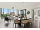 Bright and open living room with modern furnishings, large windows, and hardwood floors at 3107 Peachtree Ne Rd # 1005, Atlanta, GA 30305