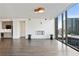 Bright living room boasting hardwood floors, modern fireplace, and large windows at 3107 Peachtree Ne Rd # 1005, Atlanta, GA 30305