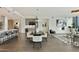 Open-concept living space with hardwood floors, modern furnishings, and a well-appointed kitchen at 3107 Peachtree Ne Rd # 1005, Atlanta, GA 30305