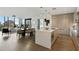 Open living space with modern island kitchen and combined dining and living areas with city views at 3107 Peachtree Ne Rd # 1005, Atlanta, GA 30305