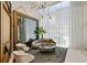 Bright lobby lounge features modern chandelier, comfortable seating, and sheer window coverings at 3107 Peachtree Ne Rd # 1005, Atlanta, GA 30305