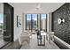 Modern office with city views, geometric accent wall, modern lighting, and comfortable seating area at 3107 Peachtree Ne Rd # 1005, Atlanta, GA 30305