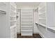 Spacious walk-in closet with custom shelving, drawers, and ample storage space; a well-organized and accessible wardrobe solution at 3107 Peachtree Ne Rd # 1005, Atlanta, GA 30305