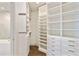 Spacious walk-in closet with custom shelving and ample storage at 3107 Peachtree Ne Rd # 1005, Atlanta, GA 30305