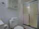Bathroom featuring a toilet and a shower with sliding glass doors at 5687 Highway 212, Covington, GA 30016