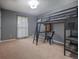 Bedroom featuring a loft bed with a built-in desk and shelves at 5687 Highway 212, Covington, GA 30016