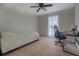 Bedroom featuring neutral walls, carpet flooring, and a ceiling fan at 5687 Highway 212, Covington, GA 30016