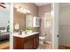 Well-lit bathroom with a spacious vanity, decorative accents, and a view into an adjacent bedroom at 1026 Lester Se Ave, Atlanta, GA 30316