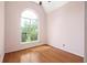 Bright bedroom with hardwood floors and a large window offering natural light and neighborhood views at 1026 Lester Se Ave, Atlanta, GA 30316