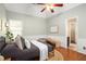 Comfortable bedroom with a ceiling fan, hardwood floors, and a window letting in natural light at 1026 Lester Se Ave, Atlanta, GA 30316