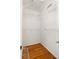 Spacious walk-in closet with hardwood floors and ample shelving for maximum storage capacity at 1026 Lester Se Ave, Atlanta, GA 30316