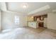 Basement with a wet bar featuring wooden cabinets and a pendant light, offering entertainment potential at 425 Fieldstone Lndg, Alpharetta, GA 30005