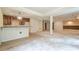 Basement bar area with wooden cabinets and granite countertop, with an open layout, ready for personalization at 425 Fieldstone Lndg, Alpharetta, GA 30005