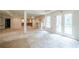 Bright basement area with natural light from French doors, showing an open layout with pillars at 425 Fieldstone Lndg, Alpharetta, GA 30005