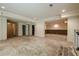 Large basement with bar, recessed lights, multiple access doors, and open floorplan at 425 Fieldstone Lndg, Alpharetta, GA 30005