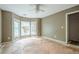 Bedroom with a bay window area and closet. Ready for renovation with ceiling fan at 425 Fieldstone Lndg, Alpharetta, GA 30005