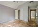 Bedroom featuring an open closet and doorway, illuminated by a ceiling fan. Renovation awaits at 425 Fieldstone Lndg, Alpharetta, GA 30005