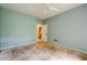 Bedroom with a ceiling fan, light green walls, and an entry door at 425 Fieldstone Lndg, Alpharetta, GA 30005