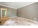 Empty bedroom with hardwood floors and neutral walls, offering a blank canvas for personalization and decor at 425 Fieldstone Lndg, Alpharetta, GA 30005