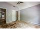 Bedroom with an open closet and two doorways, great natural light. Awaits remodel at 425 Fieldstone Lndg, Alpharetta, GA 30005