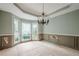 Dining room with decorative wainscoting and a bay window at 425 Fieldstone Lndg, Alpharetta, GA 30005