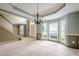 Dining room with bay windows providing ample natural light, adjacent to the stairs at 425 Fieldstone Lndg, Alpharetta, GA 30005