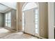 Entryway with a front door and side windows, presenting an opportunity for renovation and personalization at 425 Fieldstone Lndg, Alpharetta, GA 30005