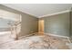 Open-concept living room featuring stairs and views into other rooms at 425 Fieldstone Lndg, Alpharetta, GA 30005
