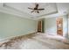 Sizeable main bedroom with ceiling fan, tray ceilings, ensuite bathroom, and lots of natural light and space at 425 Fieldstone Lndg, Alpharetta, GA 30005