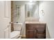 Quaint powder room with granite counters and dark cabinets, perfect for guests at 425 Fieldstone Lndg, Alpharetta, GA 30005